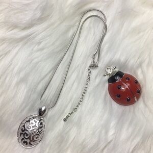 Scroll pendant, silver tone 16” necklace, NWOT.